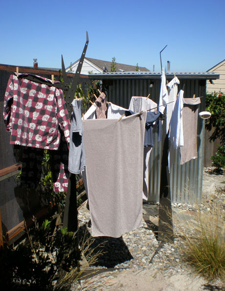 clothes drying on laundry trees by Kris Borchardt