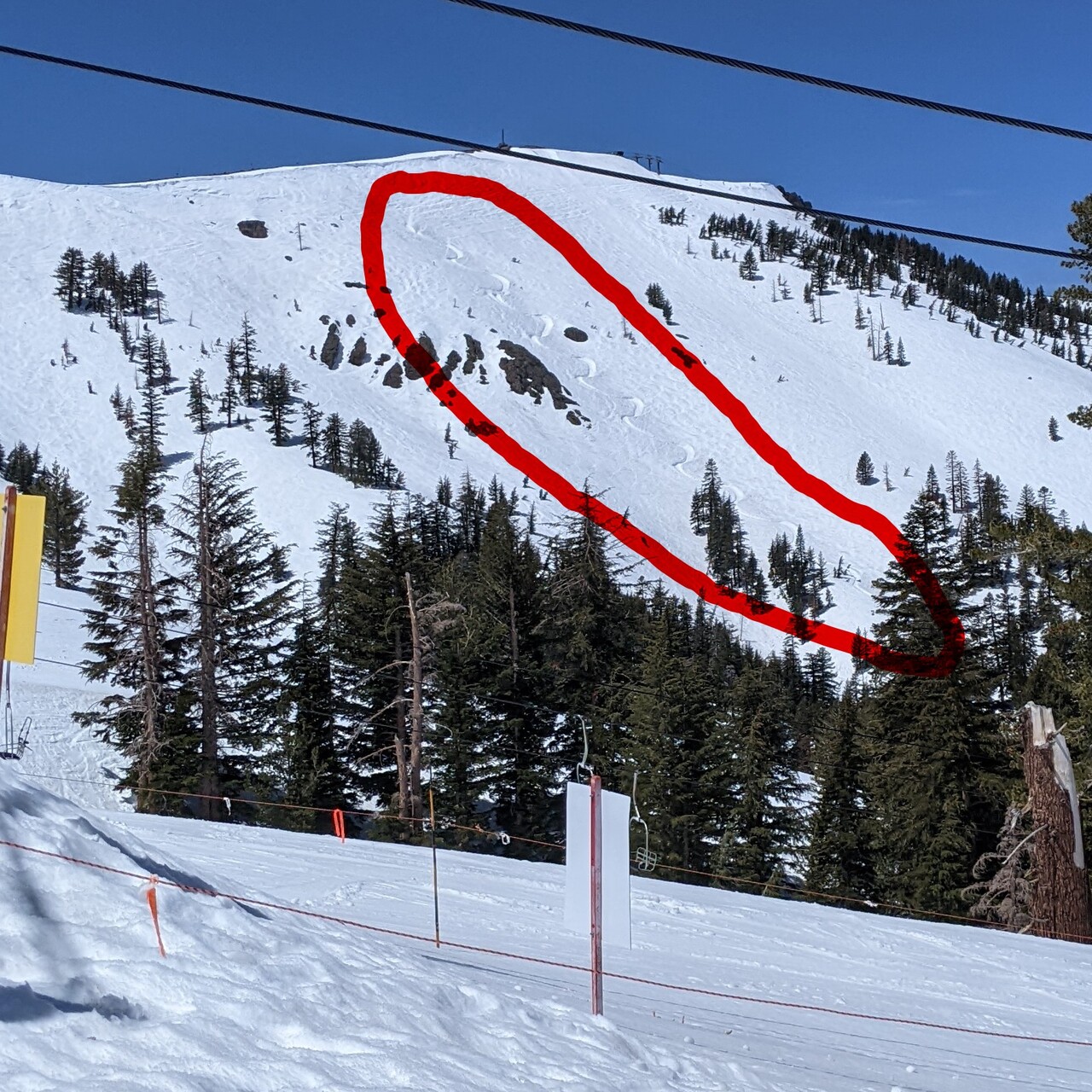 view of Wagon Wheel Bowl and Cornice Express chair, with crazy S-shaped trench in snow field highlighted