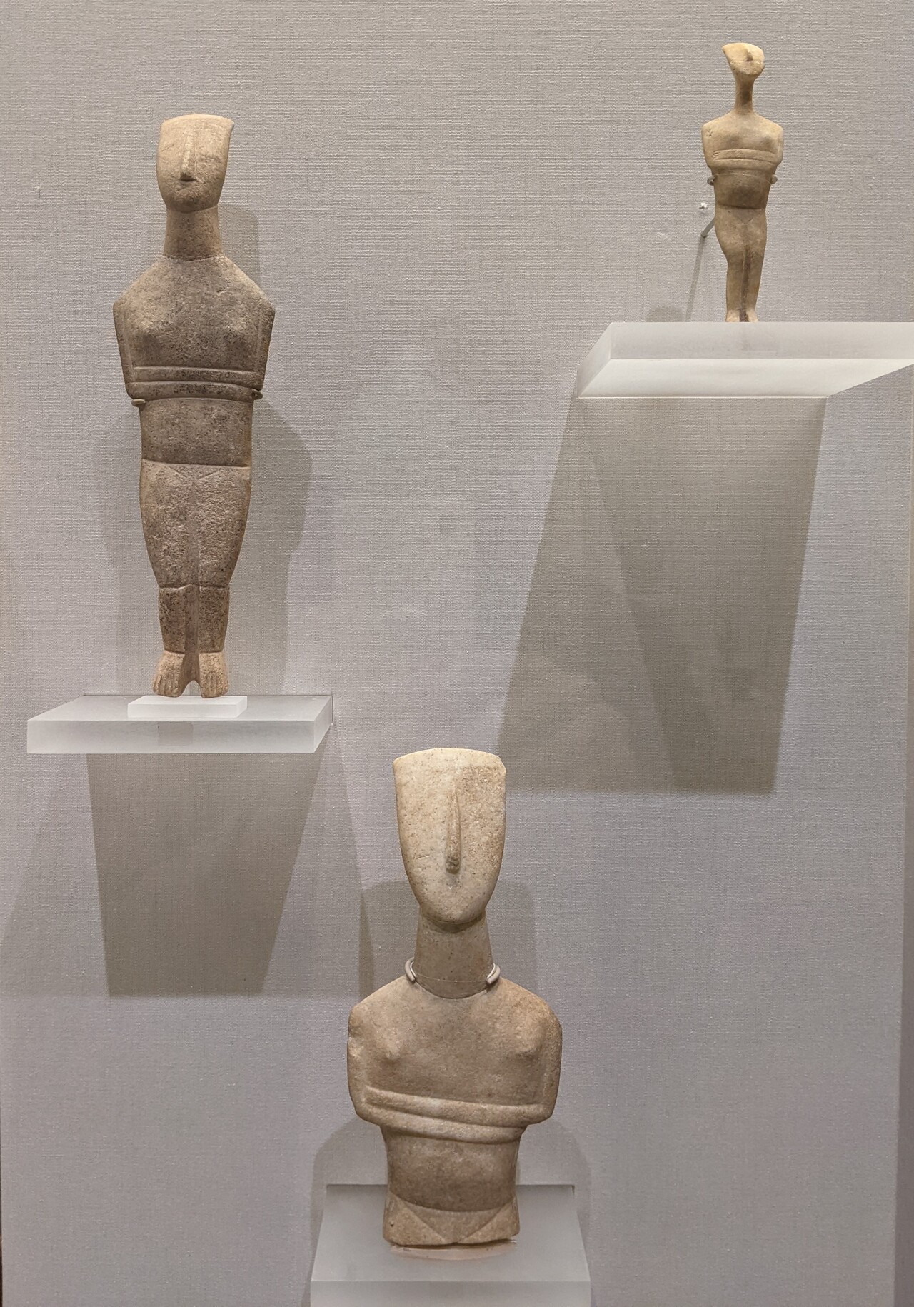 three Cycladic sculptures by the artist known as the Goulandris Master, 2500 BCE