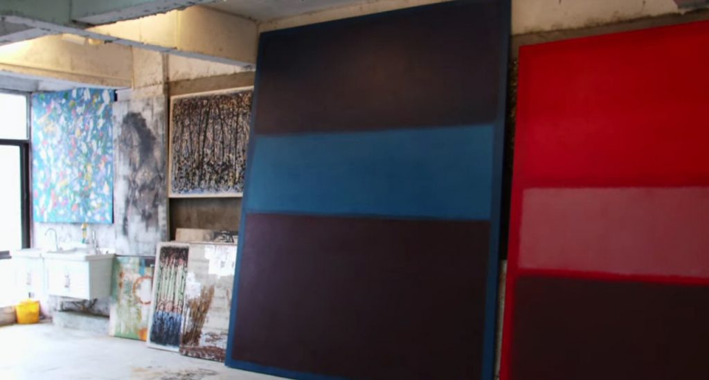 photograph of the studio of Pei-Shen Quan showing two large forged Mark Rothko paintings and other artworks